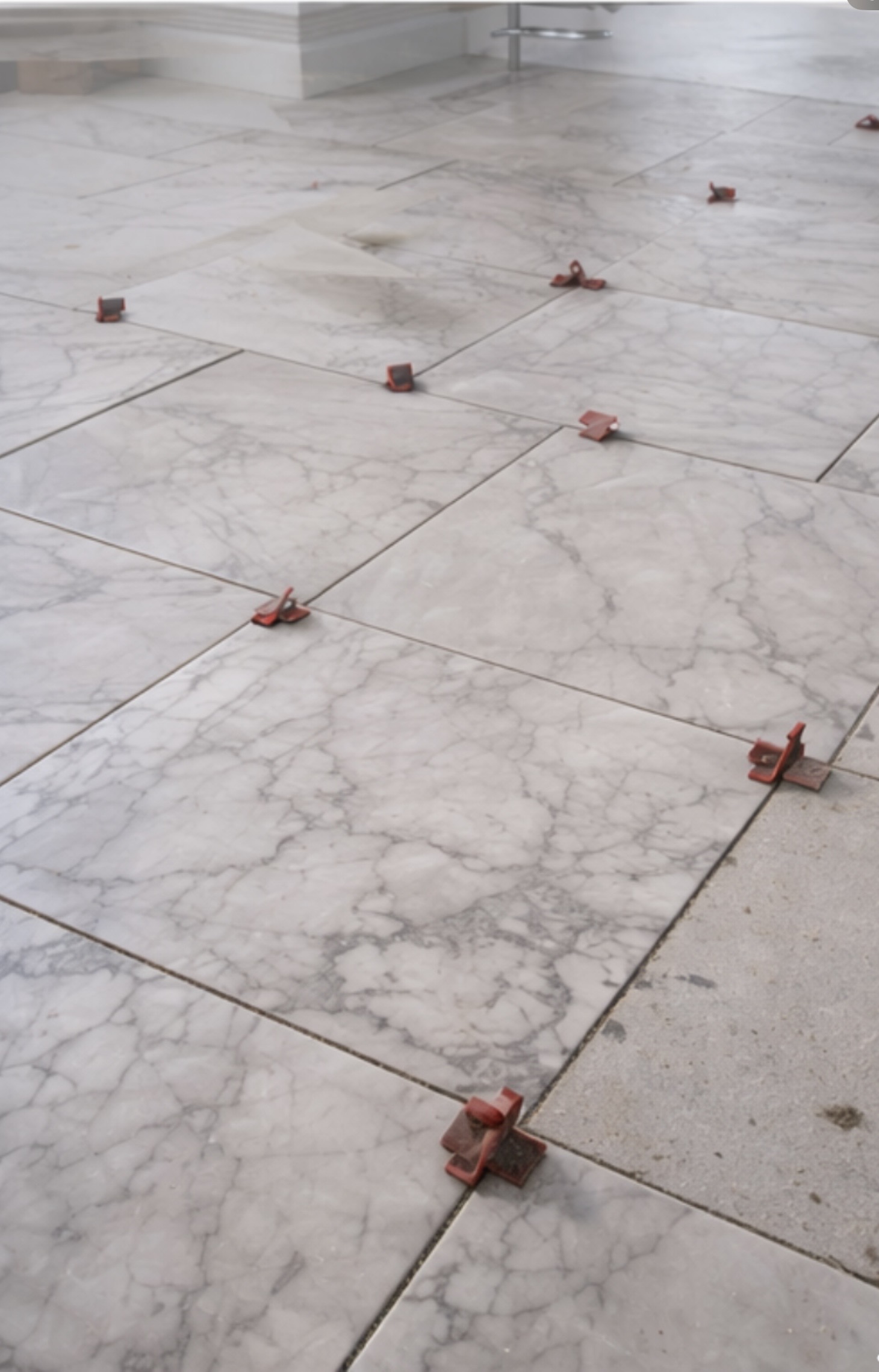 Tile floor installation in progress